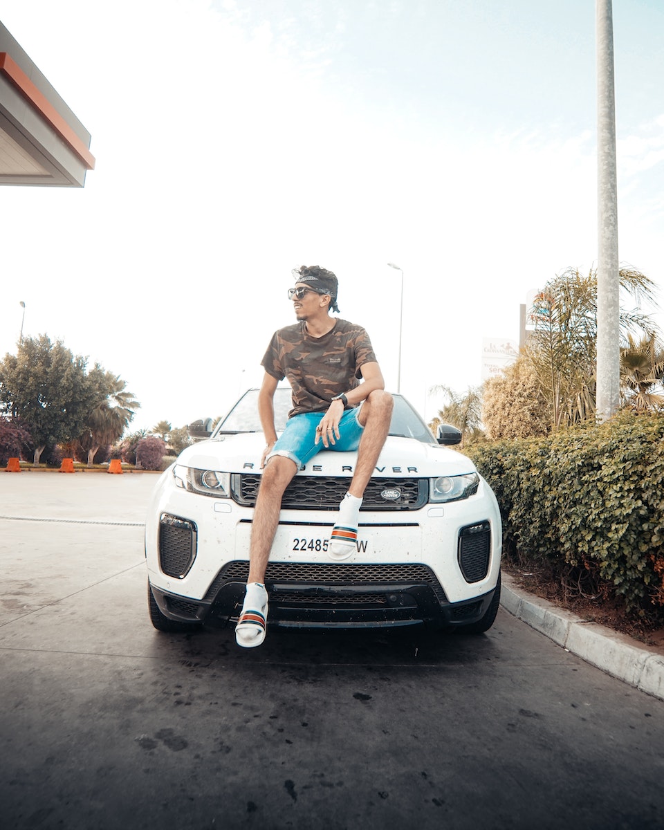 Photo of Man Sitting on White Range Rover