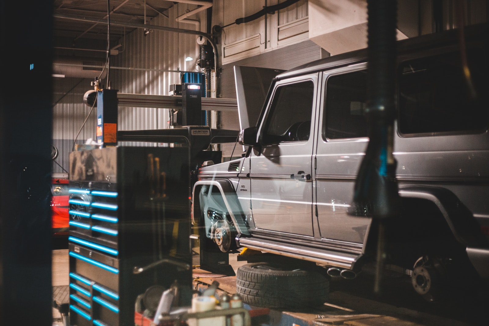 Modern massive car in workshop with equipment