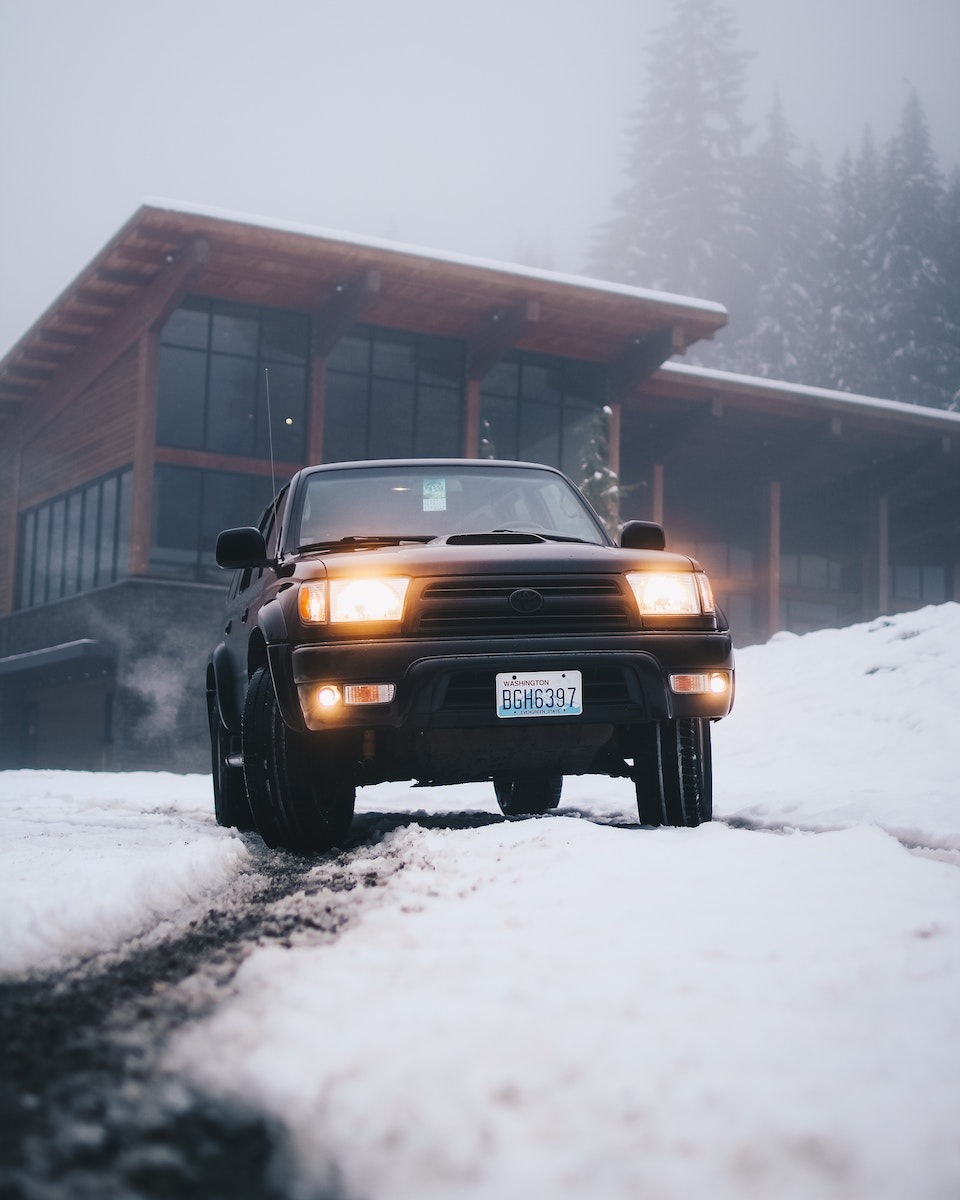 Black Toyota Vehicle on Snow Field at Daytime